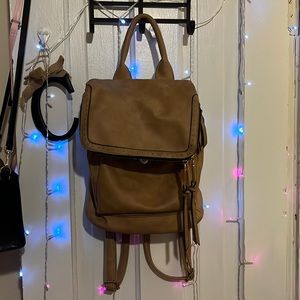 Well loved tan pleather backpack